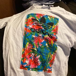 Long sleeve Adidas shirt with colorful pattern on front and down sleeve